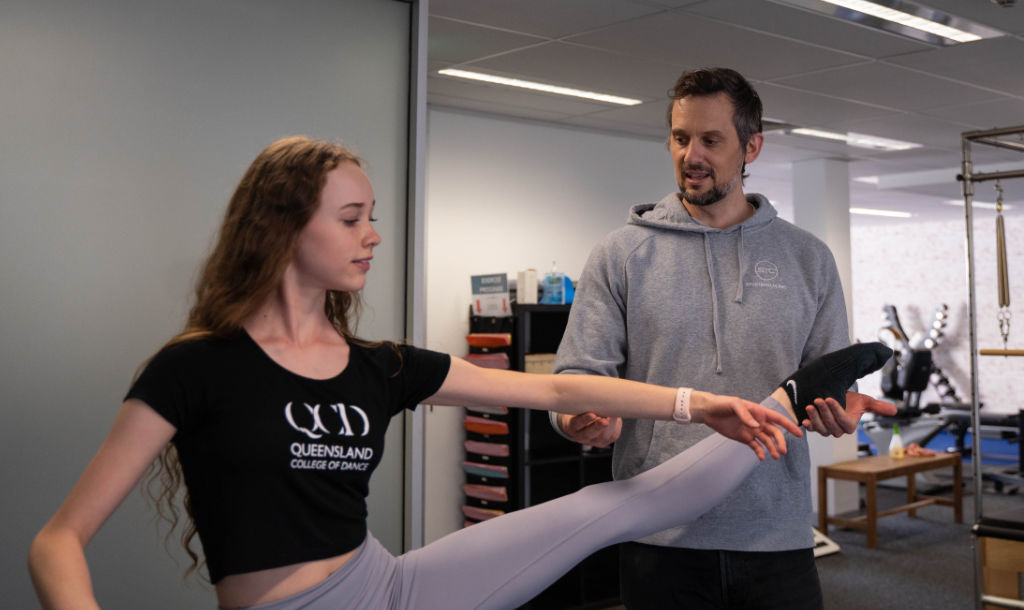 Dance student training with a qualified physiotherapist and exercise physiologist.