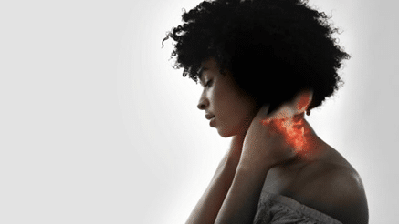 Woman holding her neck pain area